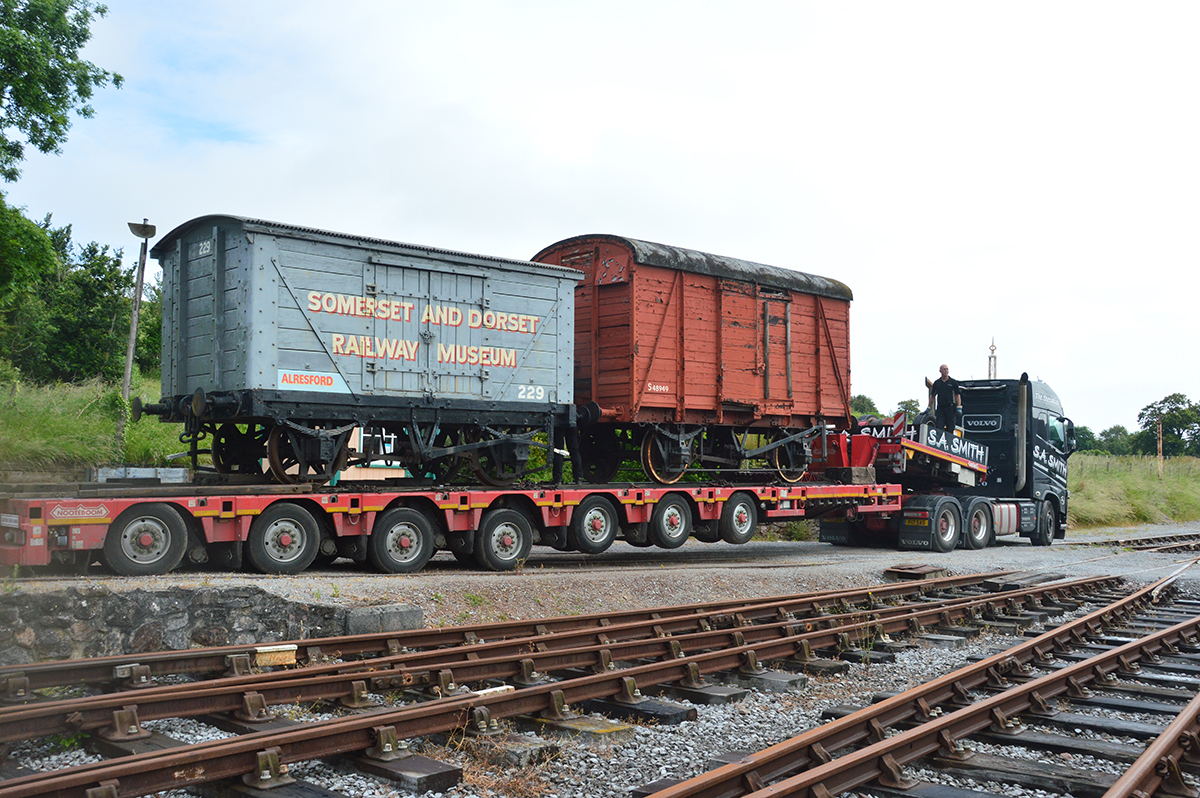 Vans waiting to leave Washford on 25 June 2021.