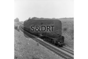 Masbury summit; 92233 on Bournemouth-Manchester service, 12 carriages, summer 1962; G A Richardson
