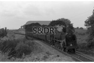 Corfe Mullen; 92000 on 1O94 Bradford-Bournemouth service, 10 carriages, 1961; G A Richardson