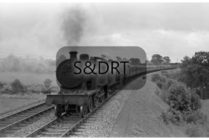 Masbury; 40569 & Class 9F on 12-car Up through service; G A Richardson