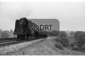 Shepton Mallet; 92001 on 11-car 1M66 SSO Bournemouth-Derby service crossing viaduct, 1962; G A Richardson